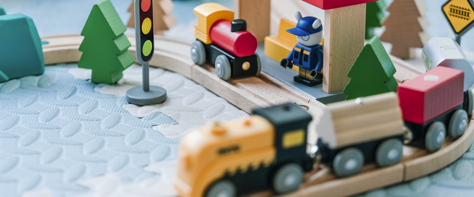 Colorful wooden building blocks and natural toys on a clean playroom floor