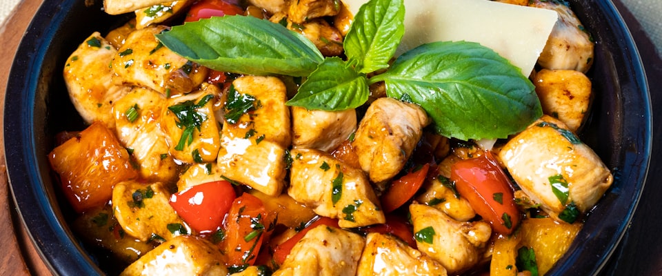 Stainless steel lunch box filled with fresh food on a wooden table — a safe, plastic-free lunch option