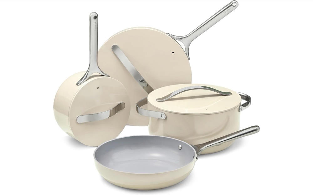 Caraway ceramic-coated cookware set in cream — fry pan, sauce pan, saut&eacute; pan and Dutch oven with stainless handles