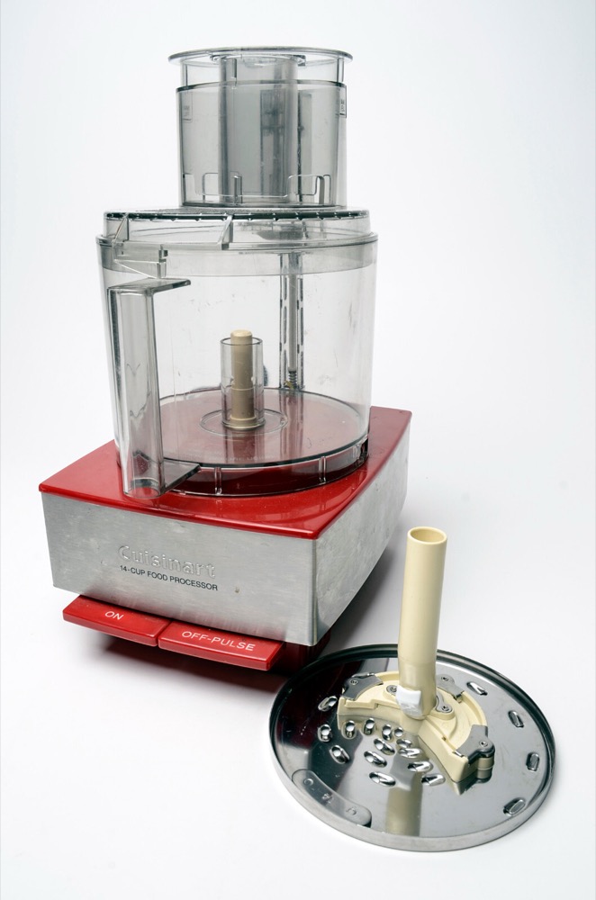 Cuisinart Custom 14 food processor with brushed stainless steel base, clear work bowl, and a stainless slicing disc