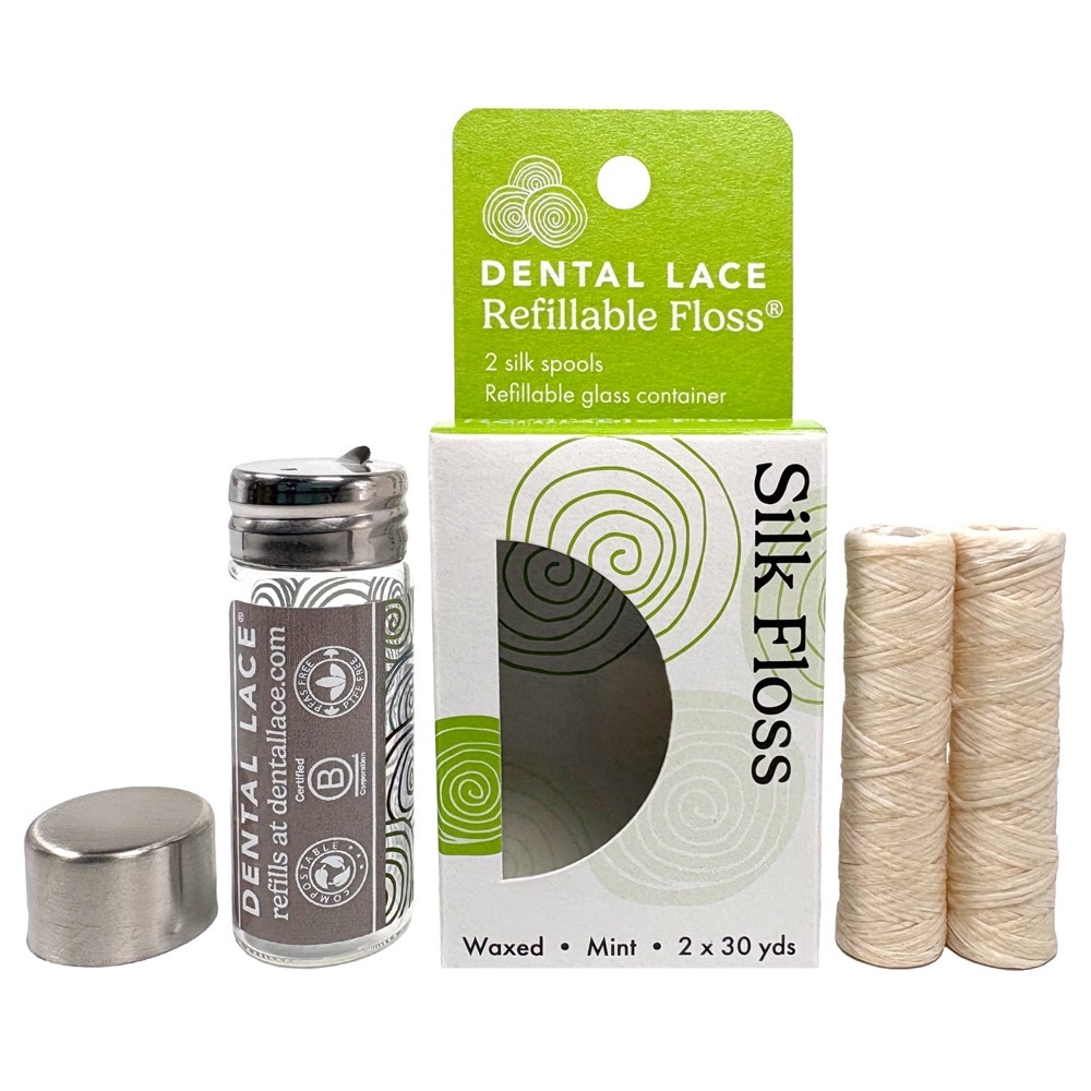 Dental Lace Refillable Silk Floss — glass dispenser with stainless cap and two mulberry silk refill spools, plastic-free packaging