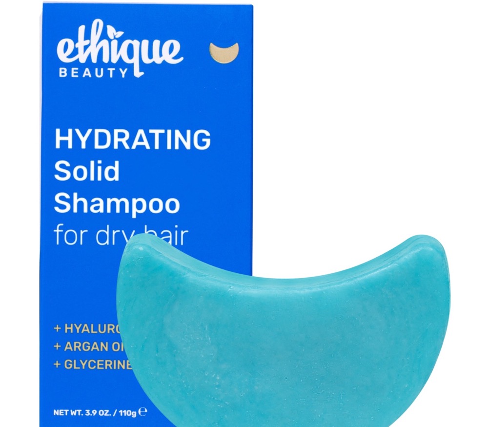 Ethique Hydrating solid shampoo bar (formerly Mintasy) — teal crescent bar beside its blue compostable Ethique box with argan oil, hyaluronic acid and glycerine for dry hair