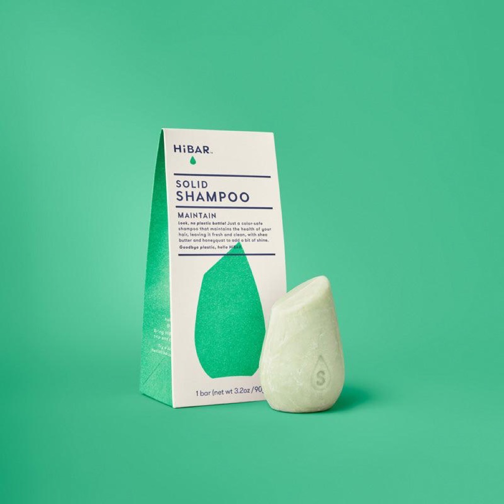 HiBAR Maintain solid shampoo bar — pale green bar beside its green-and-white cardboard HiBAR box, EWG Verified and plastic-free