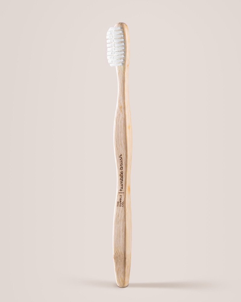 The Humble Co. Humble Brush bamboo toothbrush with ergonomic curved handle and BPA-free white bristles