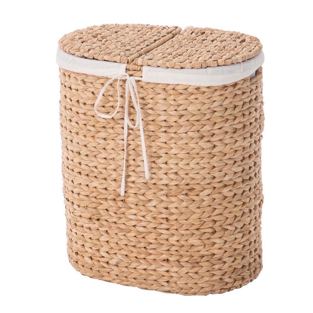 KOUBOO oval seagrass laundry sorter in pale natural fiber — two-section handwoven hamper with white cotton liner and lids