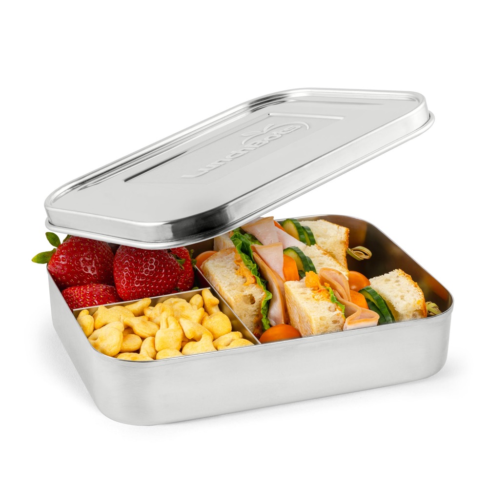 LunchBots Large Trio stainless steel lunch container — open three-section bento with welded dividers holding a sandwich, strawberries, and crackers