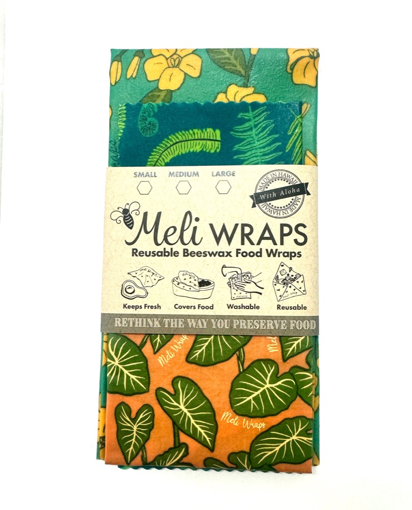 Meli Wraps reusable beeswax food wraps 3-pack with Hawaiian tropical leaf prints in its branded paper band