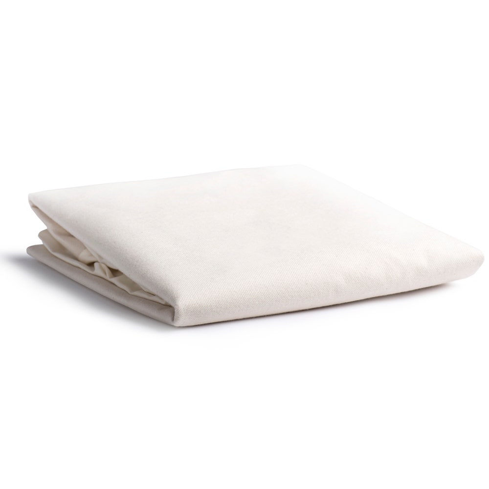 Naturepedic Organic Cotton Waterproof Protector Pad — folded fitted organic cotton crib pad with a hidden food-grade waterproof barrier