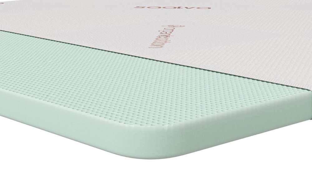 Saatva Organic Latex Mattress Topper — natural latex layer under a quilted organic cotton cover, shown on a clean background