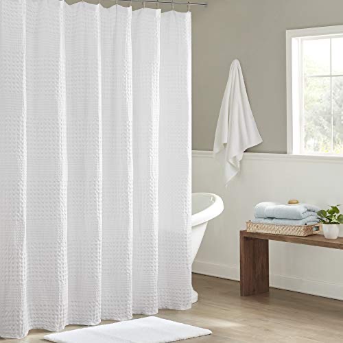 Madison Park Arlo 100% cotton waffle-weave shower curtain in white, hanging on a brushed-nickel rod