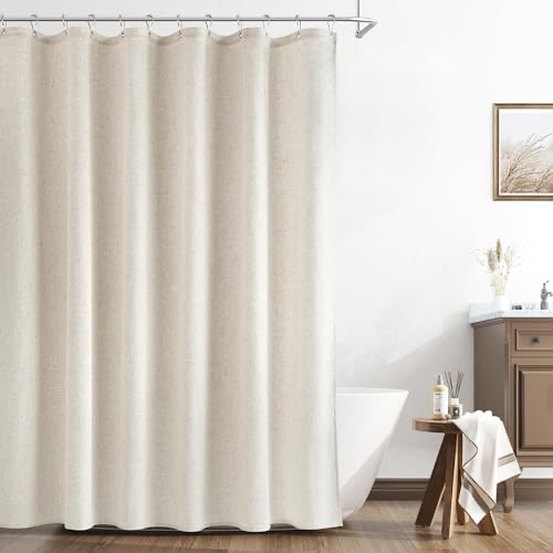 Naturoom natural linen shower curtain in white, a breathable natural-fabric curtain beside a freestanding tub in a bright white bathroom