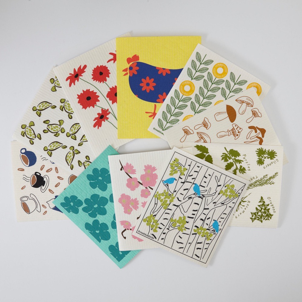 Three Bluebirds Swedish dishcloths — a fan of ten plant-based cellulose and cotton cloths in assorted printed designs